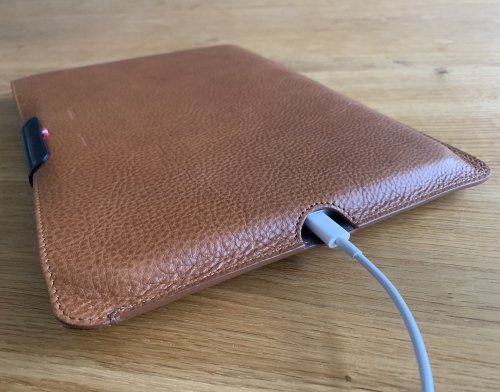 The iPad can be charged while tucked away in its case