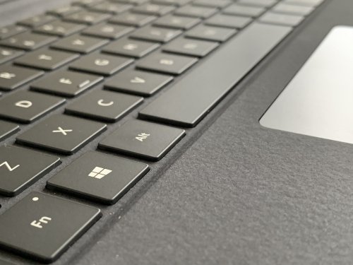 The keys are 'real' and there is a nice multi touch glass trackpad