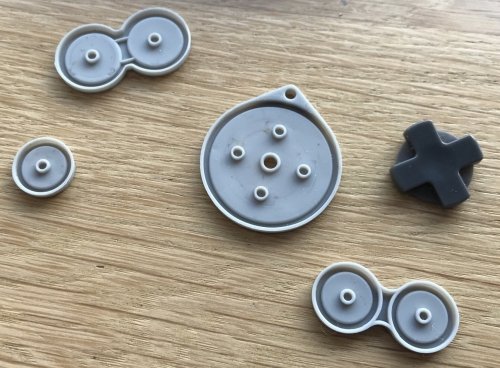 Clever hardware design: each button fits exactly on one position and orientation only!  