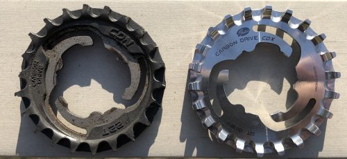 Left the plastic CDN sprocket - if you look closely you'll notice the missing teeth, right the shiny stainless steel CDX sprocket