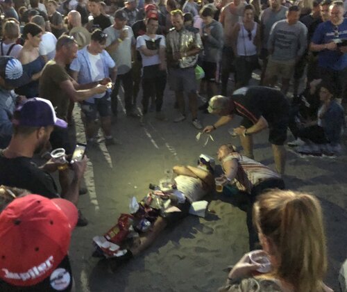 A guy with a lot of trash, spontaneous art in the crowd