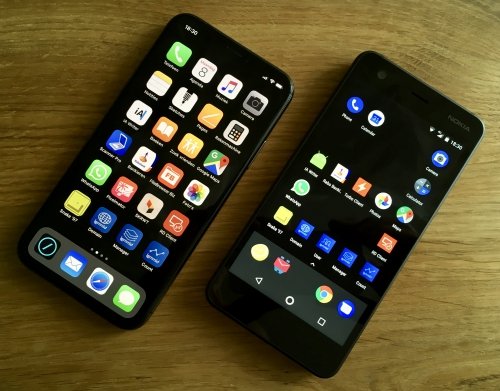 iPhone running iOS and Nokia running Android