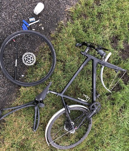 Road side servicing the bike: swapping a punctured tire