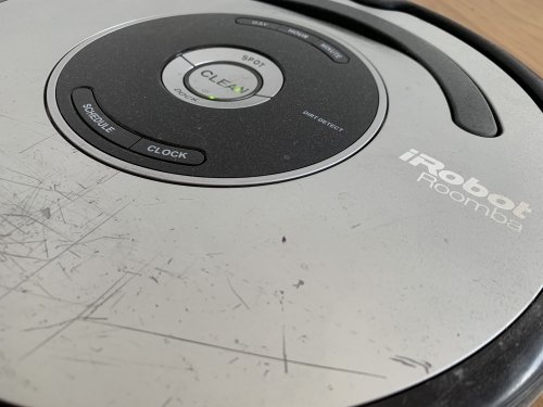 Operational since 2011, the iRobot Roomba has earned its battle scars - I wonder what it does when I'm not in the apartment...
