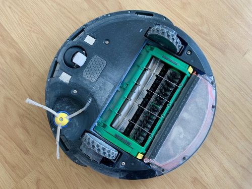 Flip the robot vacuum cleaner upside down - note the dust everywhere