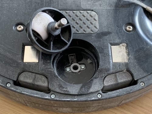 Remove dust from the sensor underneath the wheel base