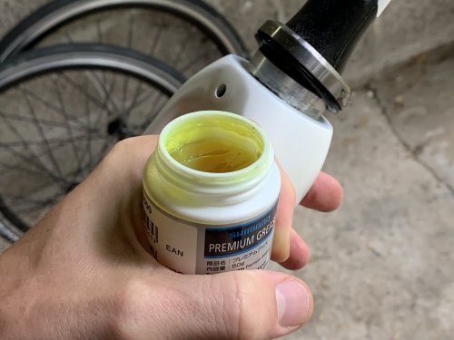 Apply grease to bearings like the ones in the front fork + headset