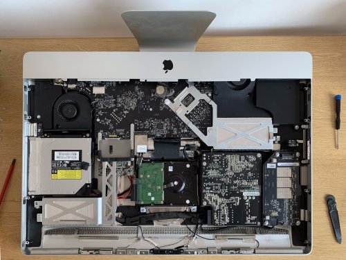 The iMac’s innards are visible after removing the display