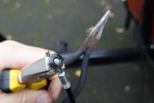 Loosening the bolt is easily done using two pliers