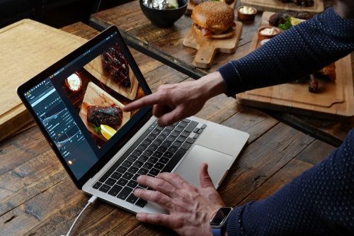 Highlights on the steak draw attention - an intentional effect created by the food photographer