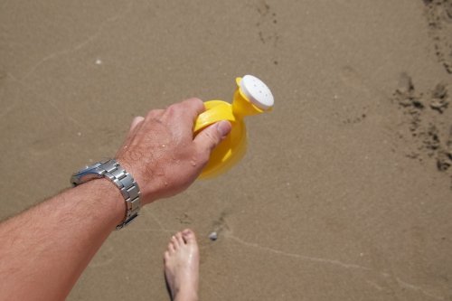 Sandy beaches and plastic watering cans pose no problem for the stainless steel case