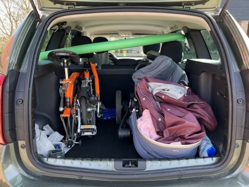 The Brompton in our family car: taking up less space than a baby stroller!
