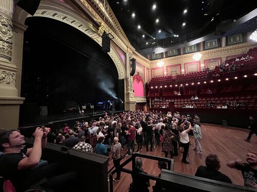 The audience gathering inside the classic theatre