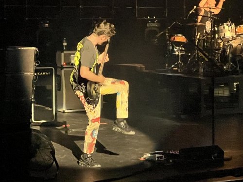 Matthew Bellamy playing the guitar - you know you're in a small theatre when you can read the text on his shirt / pants