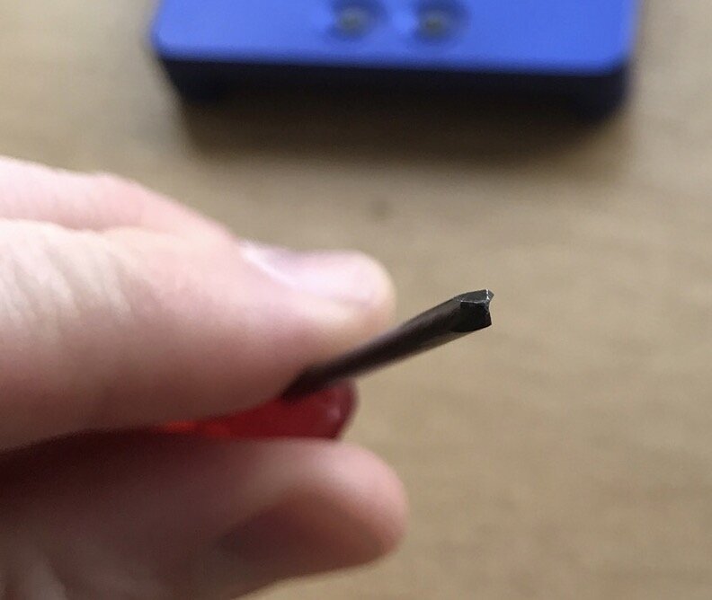 Using the right tools: a Tri-wing triangular screwdriver