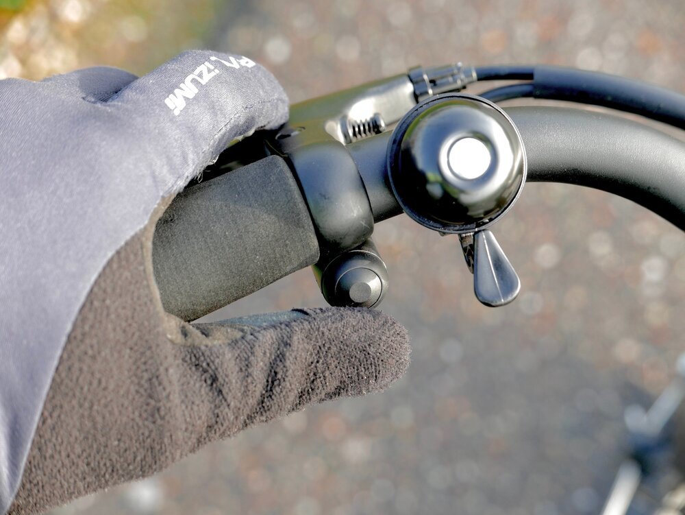 The booster button, conveniently positioned near the left thumb