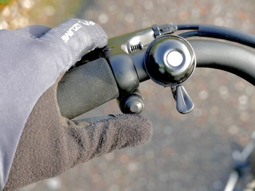 The booster button, conveniently positioned near the left thumb