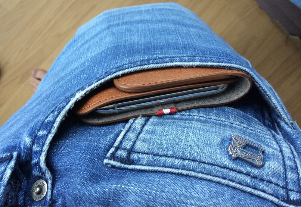 The wallet allows quick (and naked) access to the phone