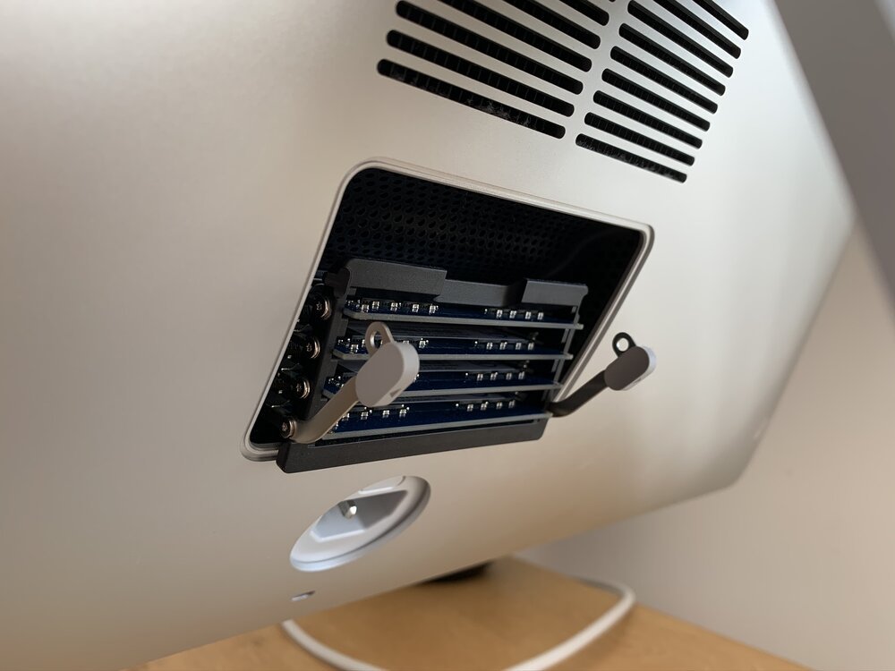 The RAM hatch pops open using the secret button inside the power connector