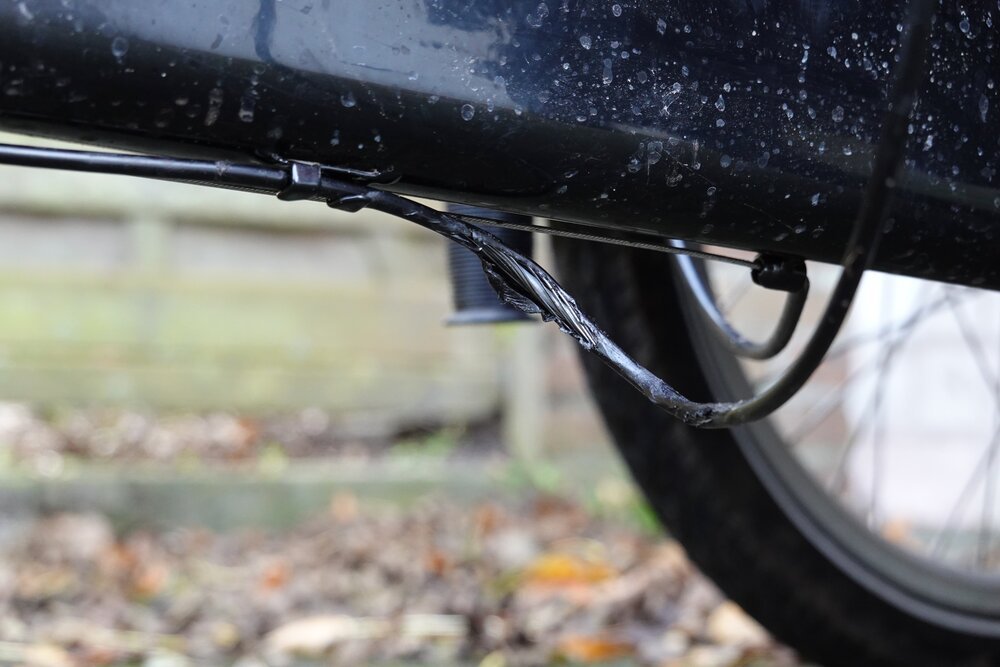 The shifter cable underneath the cargo bike was pulled apart by a branch...