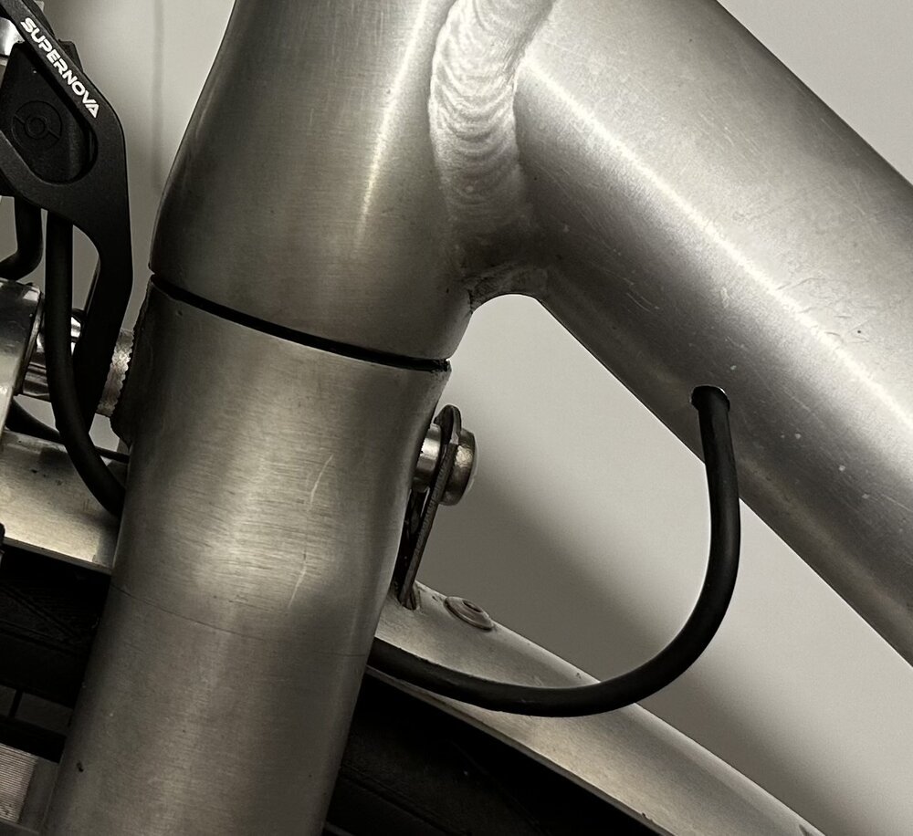 The wire to the rear light goes inside a newly drilled hole in my bike frame - leaving just enough cable for my steering wheel to turn