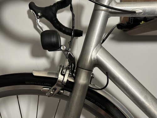 The head light is fitted on my front brake calliper - to keep my handle bar free for some future bike packing adventures