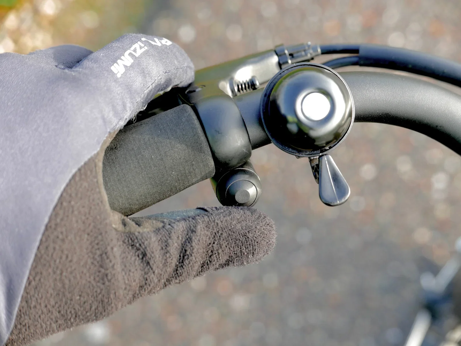 The booster button, conveniently positioned near the left thumb