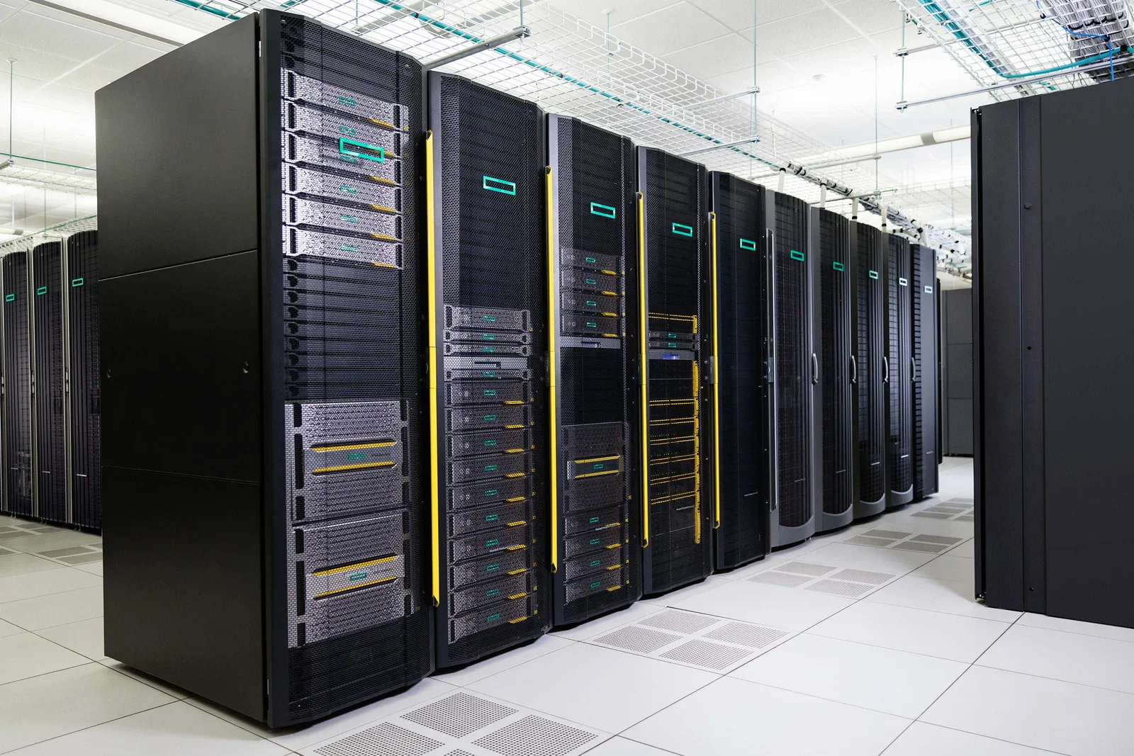 Servers in a datacenter: the black racks are like closets for the grey server computers, each rack fits multiple servers (photo: HPE).