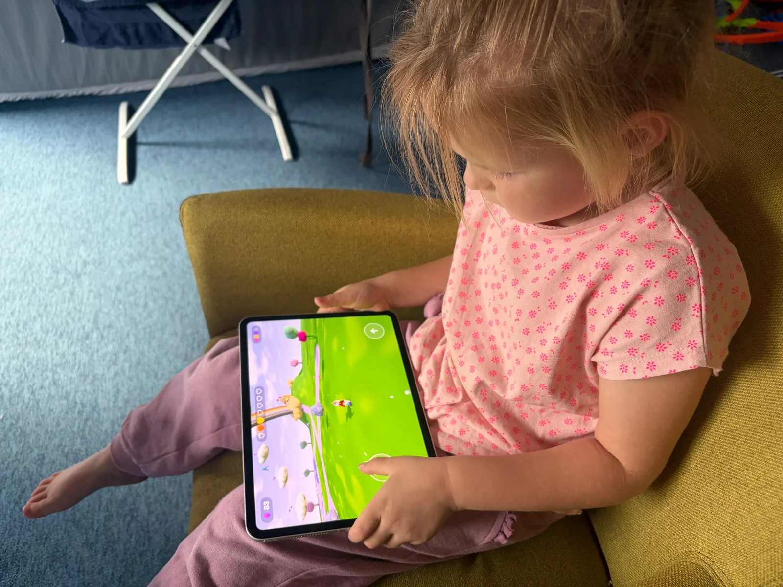 Nora playing the game that came out of her drawing