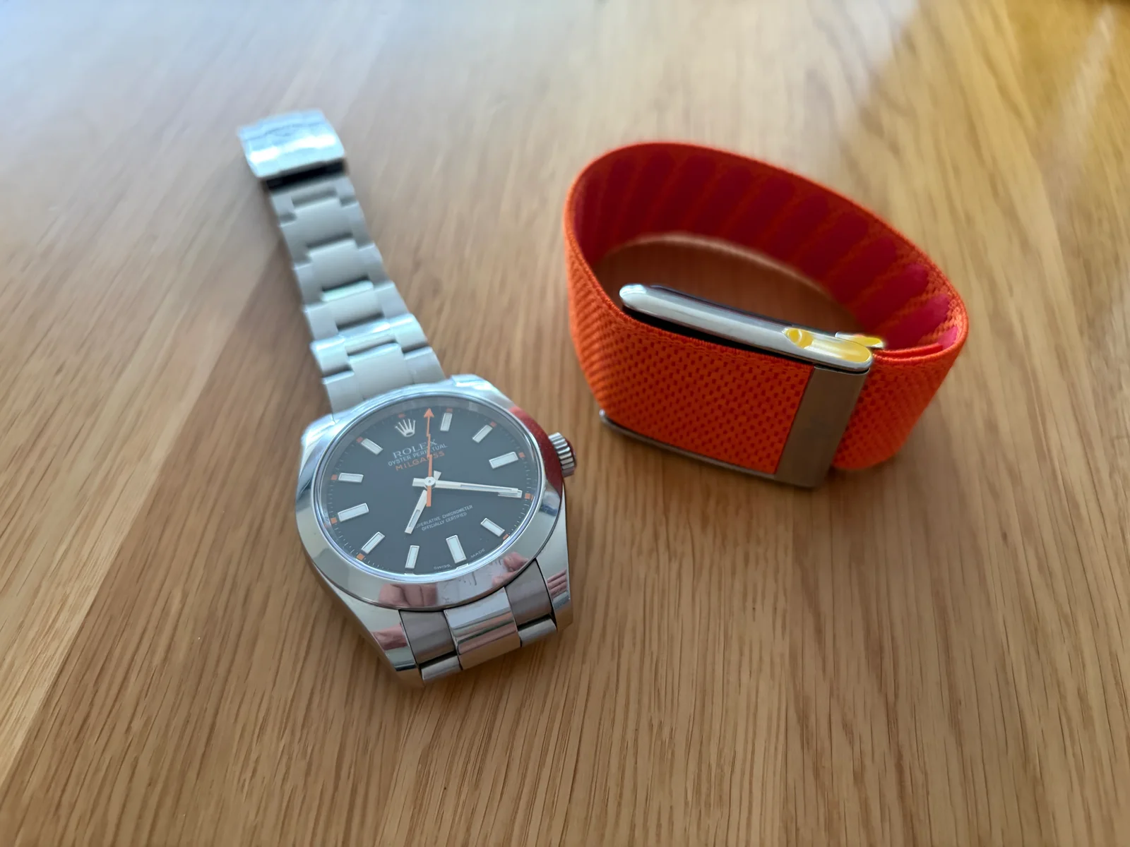 The two that stayed: a mechanical watch and the WHOOP band, on the morning of a 21K trail run
