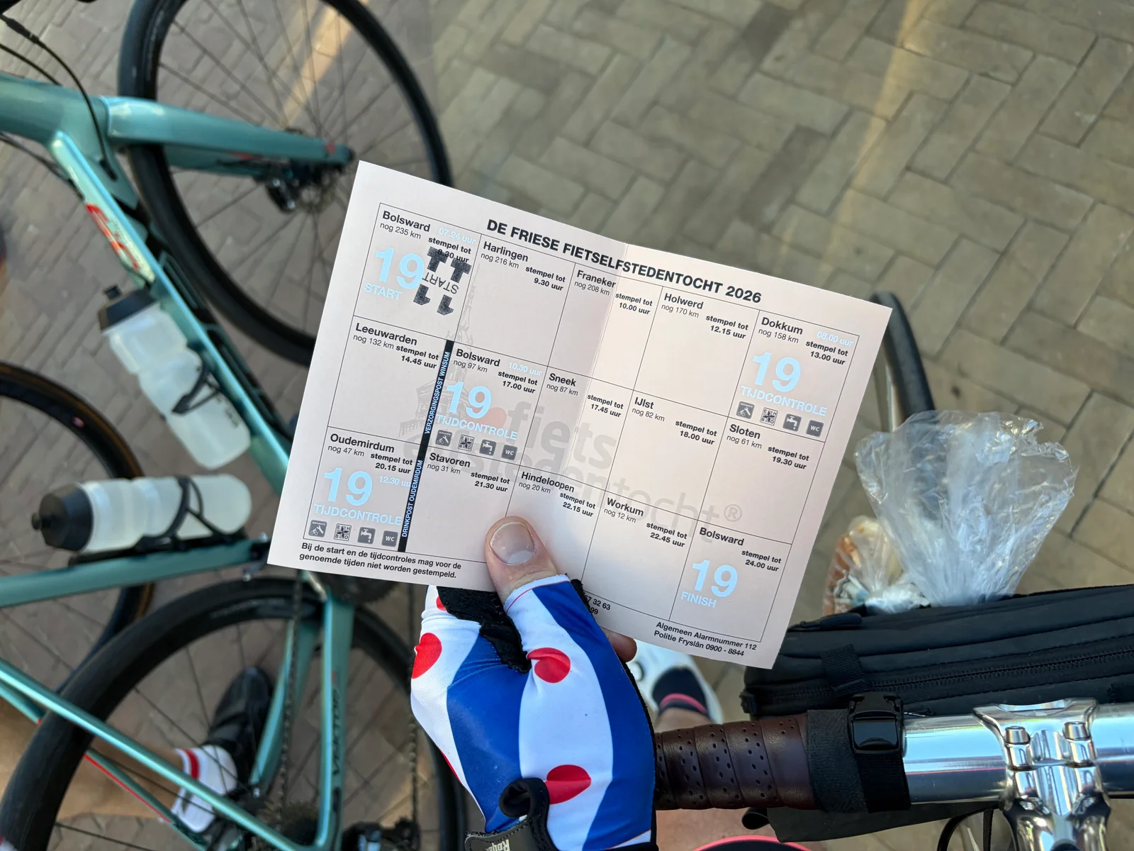 The stamp card of De Friese Fietselfstedentocht 2026, Frisian flag on the gloves