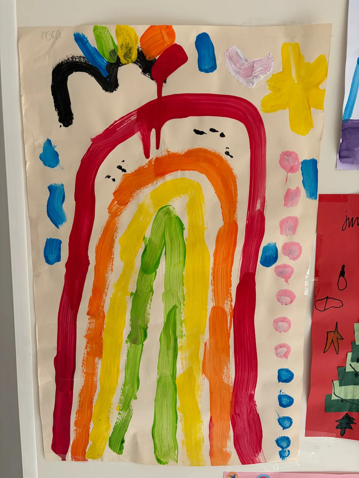Nora's input for her game: a rainbow, clouds and colours to collect