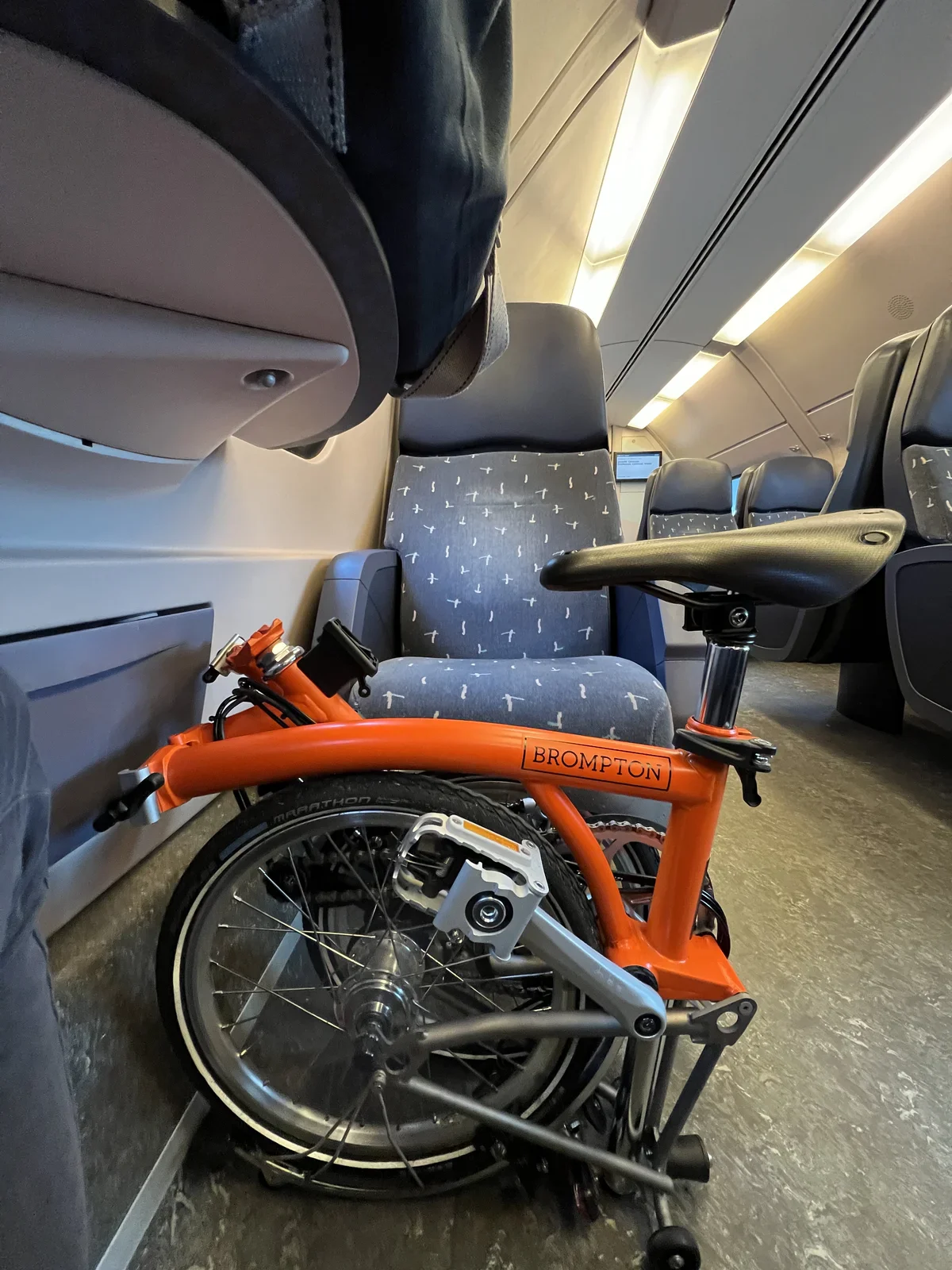 No need to pay extra for the foldable bike in the train: it is considered "normal luggage"