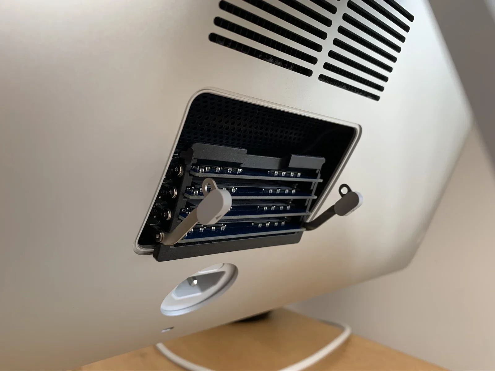 The RAM hatch pops open using the secret button inside the power connector