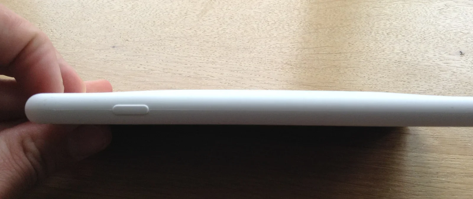 The iPhone with case is only slightly thicker.