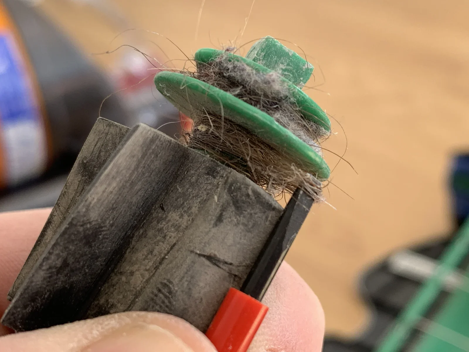 Use a screw driver to cut hairs loose