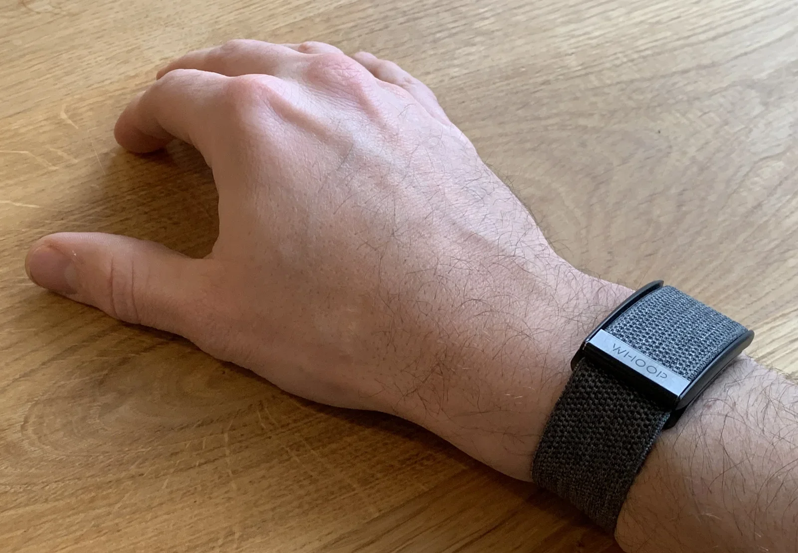 WHOOP Strap 3.0 on the wrist, no buttons, no display
