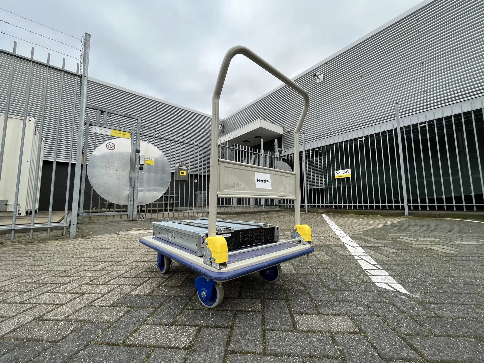 A "cloud cart", loaded with a decommissioned computer on it, outside the datacenter