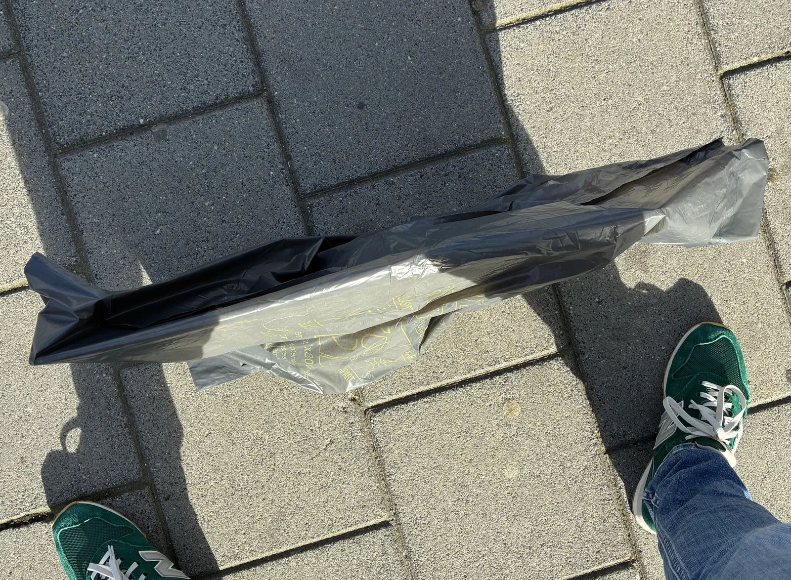 Waiting on the platform for my train with an Apple in a bag...
